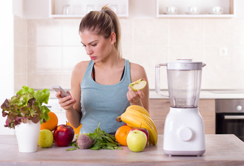 Girl with fresh fruit at kitchen table