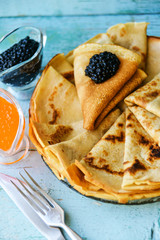 Russian Maslenitsa, pancakes with red and black caviar