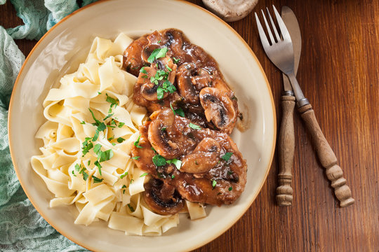 Delicious Chicken Marsala Served With Fettucine Pasta