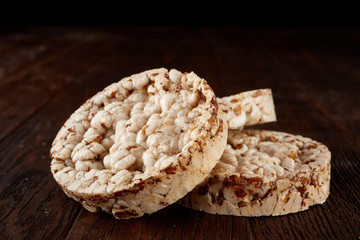 Stack of crispbreads on dark wooden table