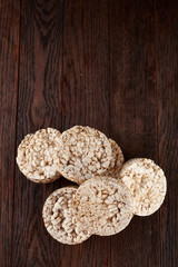 Stack of crispbreads on dark wooden table