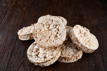 Stack of crispbreads on dark wooden table