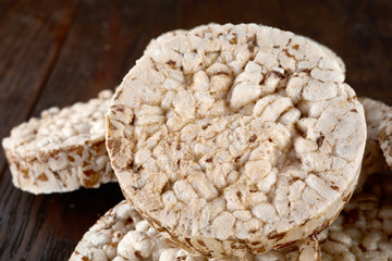 Stack of crispbreads on dark wooden table