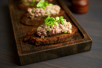 bruschetta, on slices of toasted baguette garnished with basil