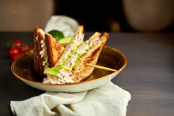 Top view of Healthy Sandwich toast with lettuce, ham, cheese and tomato on a wooden background