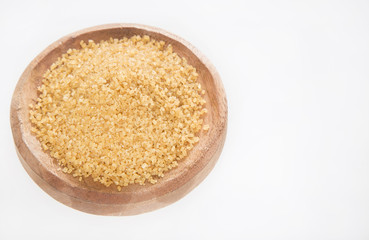 Fototapeta na wymiar Brown sugar in the bowl - Saccharum officinarum