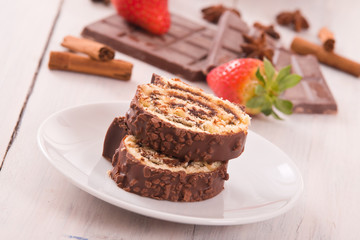 Chocolate roll with strawberries. 