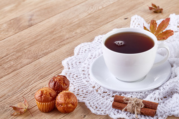 white cup of tea with cookies on a wooden background white cup of tea with cookies on a wooden background. copy space.