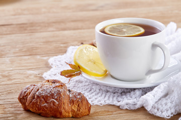 white cup of tea with cookies on a wooden background white cup of tea with cookies on a wooden background. copy space.