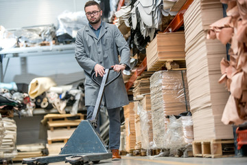 Working at leather warehouse at shoe factory used warehouse equipment