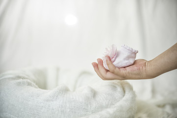Fototapeta premium Baby shoes in hand