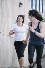 Naklejka premium two running woman in the street