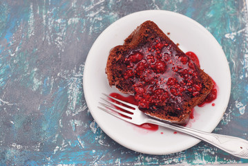 Piece of Pie with Berry Jam. White Plate with Fork over Blue vintage Board.