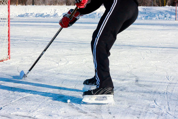ice hockey player in action kicking with stick