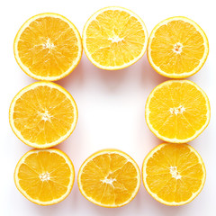Creative flat layout of fruit, top view. Sliced orange isolated on white background. Food wallpaper, composition pattern of fresh citrus fruits.