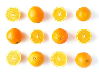 Creative flat layout of fruit, top view. Sliced orange isolated on white background. Food wallpaper, composition pattern of fresh citrus fruits.