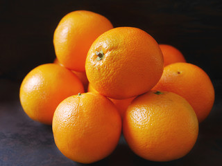 Oranges on a dark background.