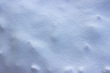 winter background snow texture illuminated by the sun