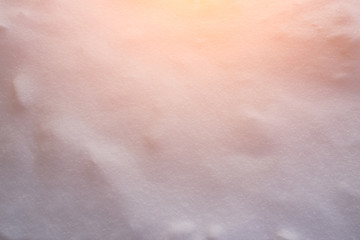 winter background snow texture illuminated by the sun