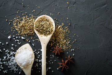  Wooden spoon with Italian seasoning-dried oregano with thyme vegetables.Oregano in a wooden spoon...