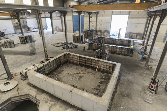 newly made cement blocks and structures. One still has the metal frame-mold