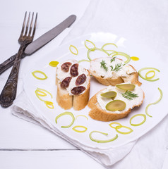 sandwiches with cream cheese on a white plate