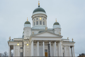 Fototapeta na wymiar View of the Helsinki Cathedral, Finnish Lutheran Evangelical Church, belonging to the diocese of the capital of Finalndia. The temple is white with blue domes and golden details