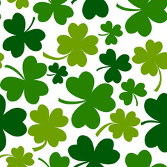 Fototapeta na wymiar Green seamless pattern with four and tree leaf clovers for Saint Patrick's Day. Vector illustration