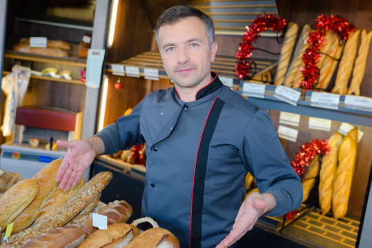 Baker presenting his range of breads