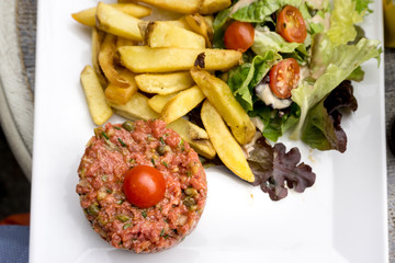 tasty Steak tartare (Raw beef) - classic steak tartare on white plate