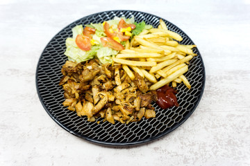 Fresh chicken steak with tomatoes and french fries
