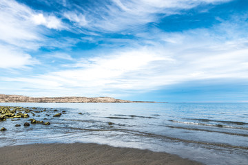 Puerto Madryn beach, sun, waves and sand, beautiful day.