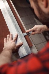 Working process in the leather workshop. Tanner in old tannery.