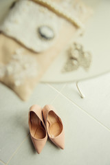 Fototapeta na wymiar charges, tender bride's morning. wedding shoes beige