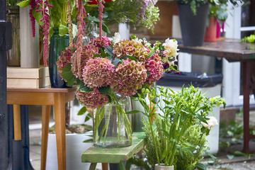 the Bouquets of a large red hydrangea for sale at the entrance to the store