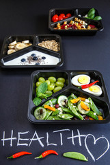 Healthy food and diet concept. Dietary catering. Restaurant dish delivery. Fitness meal. Take away. Fit and eat. Weight loss nutrition in foil boxes.