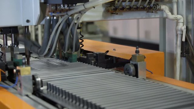 Working Conveyor Belt on the heating radiator Plant with Spot Welding Robots