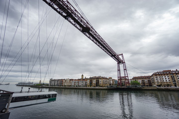 Ultra Wide view closeup of the Bizkaia suspension bridge, cloudy day