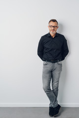 Obraz premium Full length portrait of middle-aged confident man