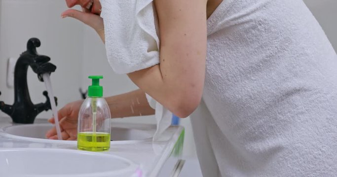 Woman wakes from sleep and she was cleansing her face