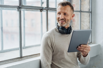 Smiling middle-aged man looking to the side