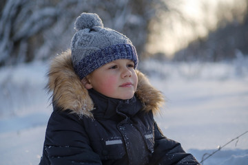 cute boy on a walk on a winter day