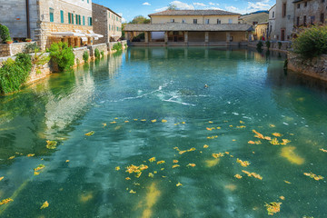 Old thermal baths in the medieval village Bagno Vignoni, Tuscany, Italy