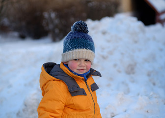 Fototapeta na wymiar cute boy on a walk on a winter day
