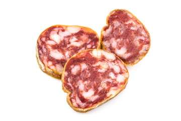 Top view macro detail of smoked salami slices, pepperoni slice, Italian prosciutto crudo ,raw ham texture isolated on white background , with clipping path.