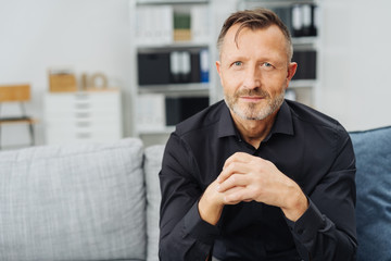 Attentive man gazing at the camera