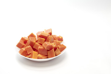 Papaya slices in white plate