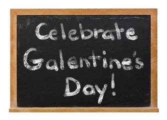 Celebrate Galentine's Day written in white chalk on a black chalkboard isolated on white