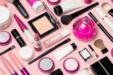 Set of makeup cosmetics, brushes, concealer and other essentials on pink background - 190537635