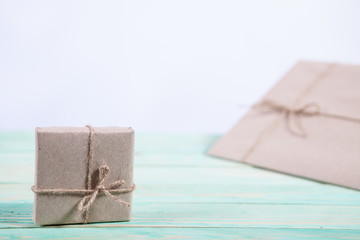 Gift boxes wrapped kraft paper tied with twine and paper snowflake and tied with twine. with copy space